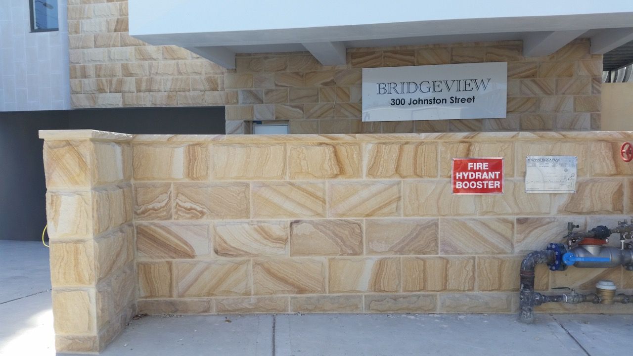 Sandstone front fence — Mega Stoneworks, Sydney